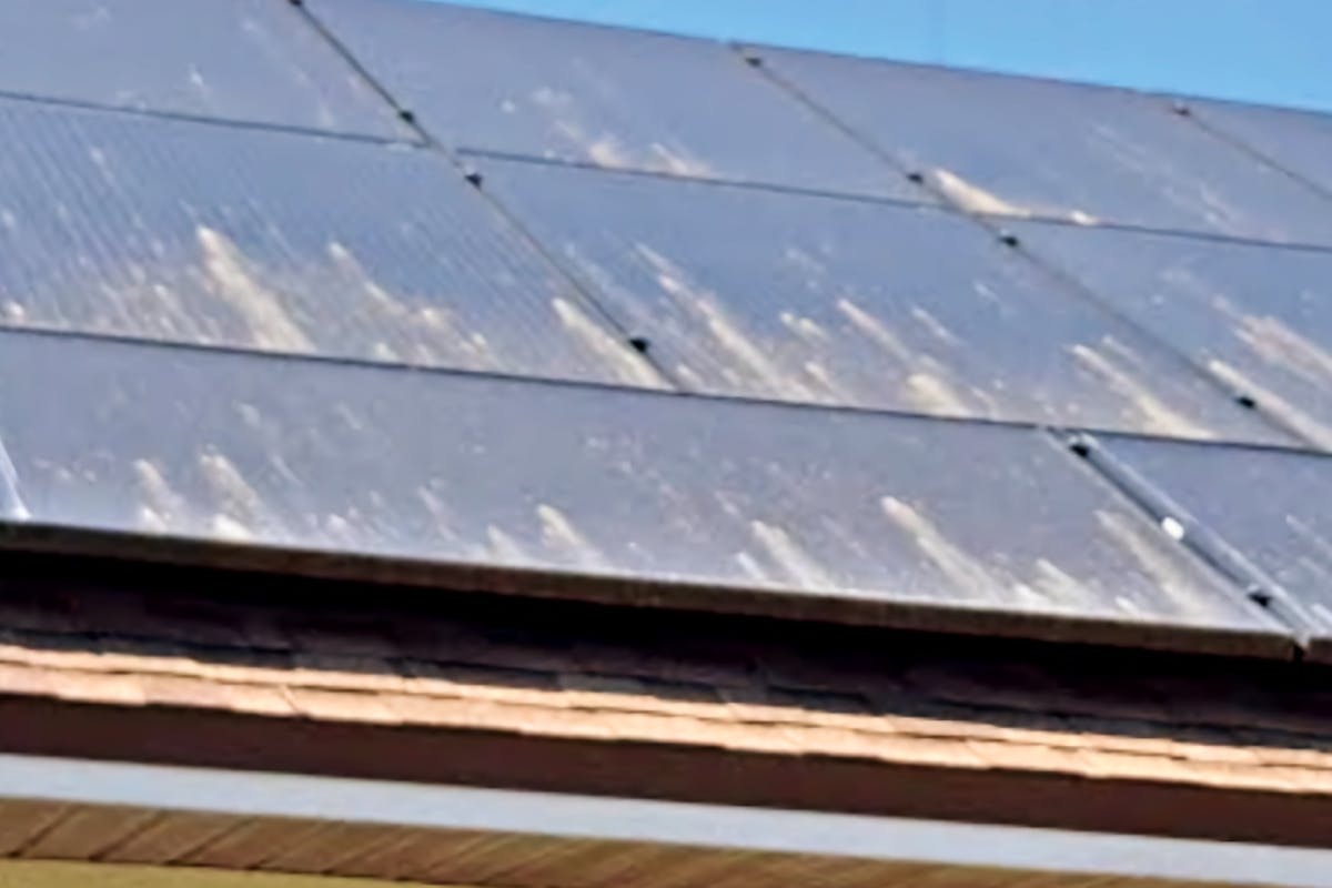 Dirty solar panels in need of a good solar panel cleaning after being covered in pollen.