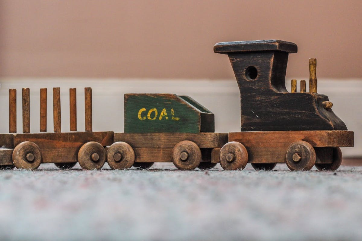 A toy coal train demonstrating the environmental impact of going solar.