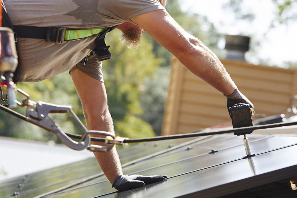 Palmetto Solar Installers Adding Panels To The Roof Of A Home