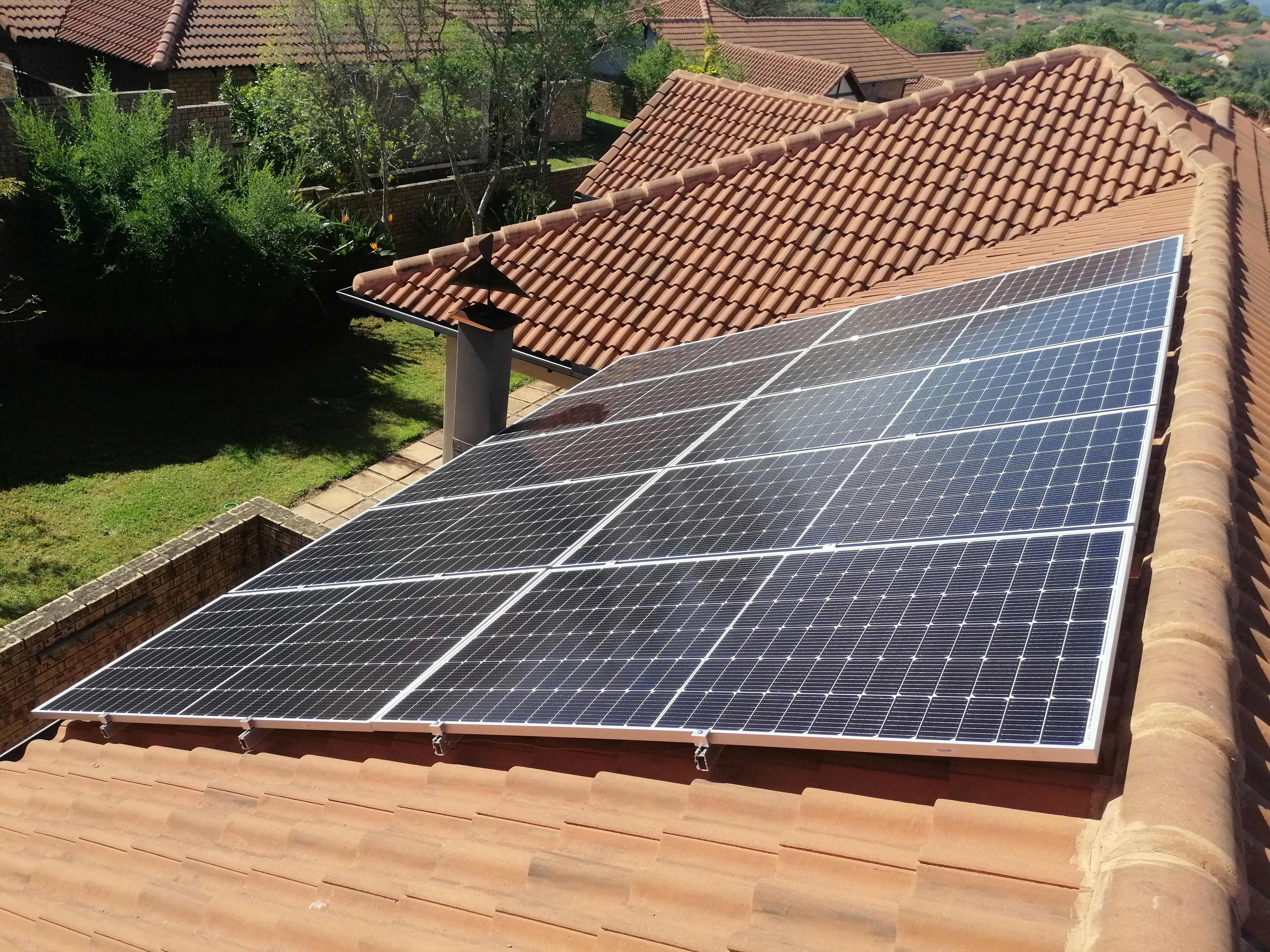 Solar panels on a tile roof.