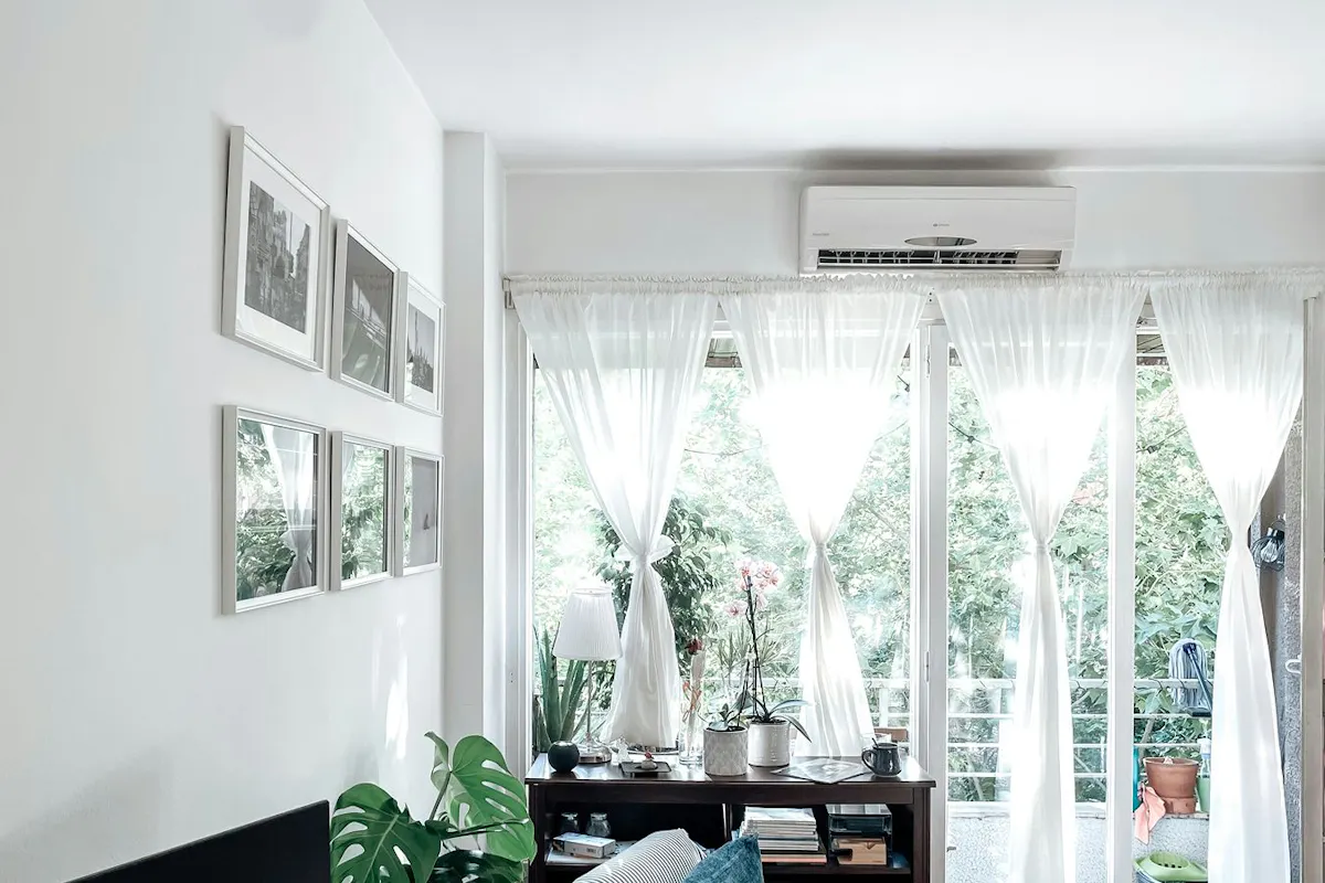 A mini-split air handler in a brightly lit room.