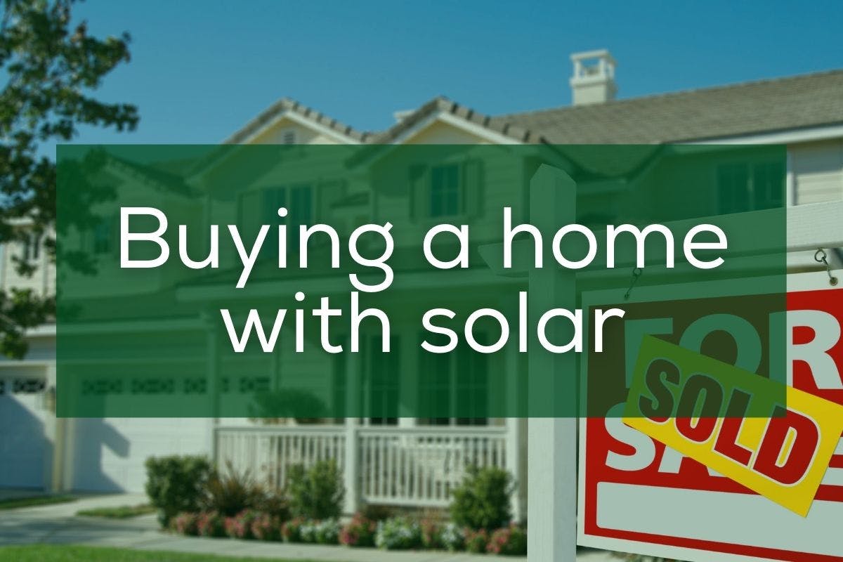 The words "Buying A Home With Solar" over an image of a solar-powered house with a Sold sign out front.