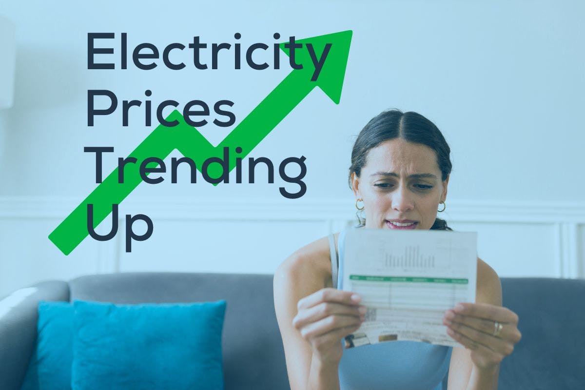 Concerned woman reviewing her electricity bill, with the headline "Electricity Prices Trending Up" over top.