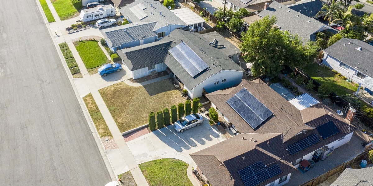 Solar powered homes with solar panels on various roof sizes and shapes.