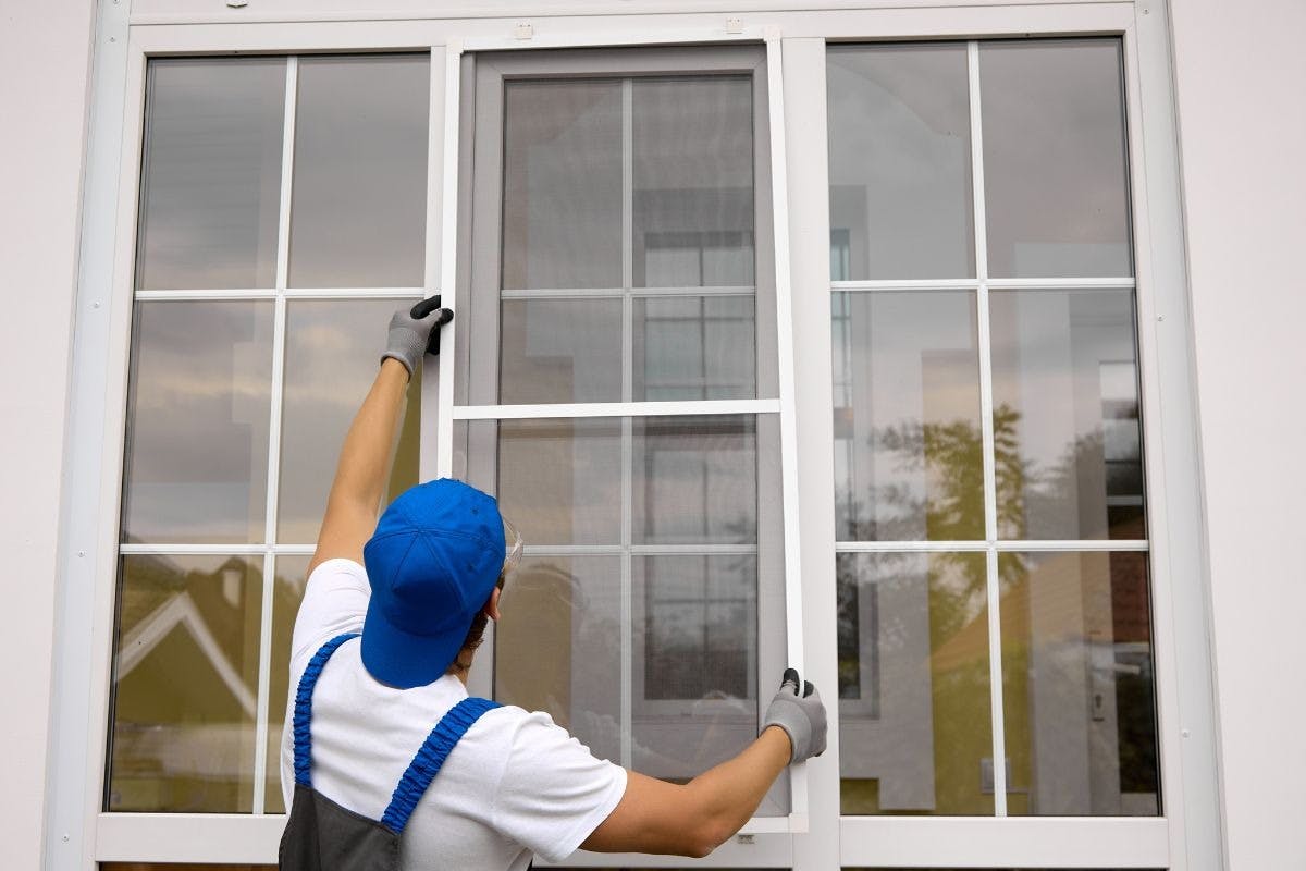 A window installer working on a window.