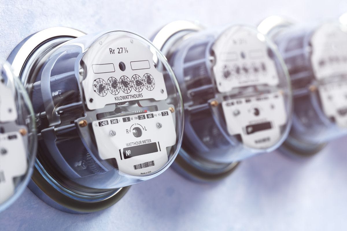 Electric meters lined up in a row.