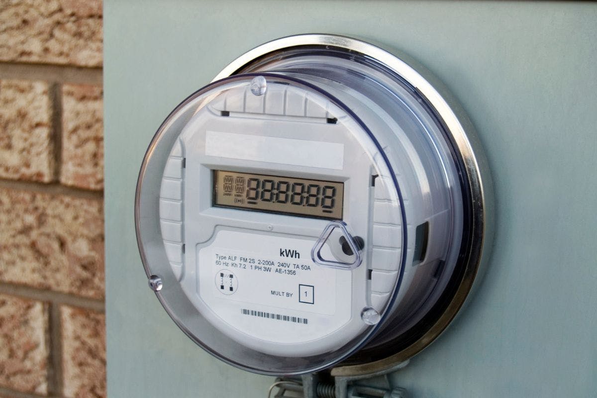 An electric meter measuring kilowatt-hours.
