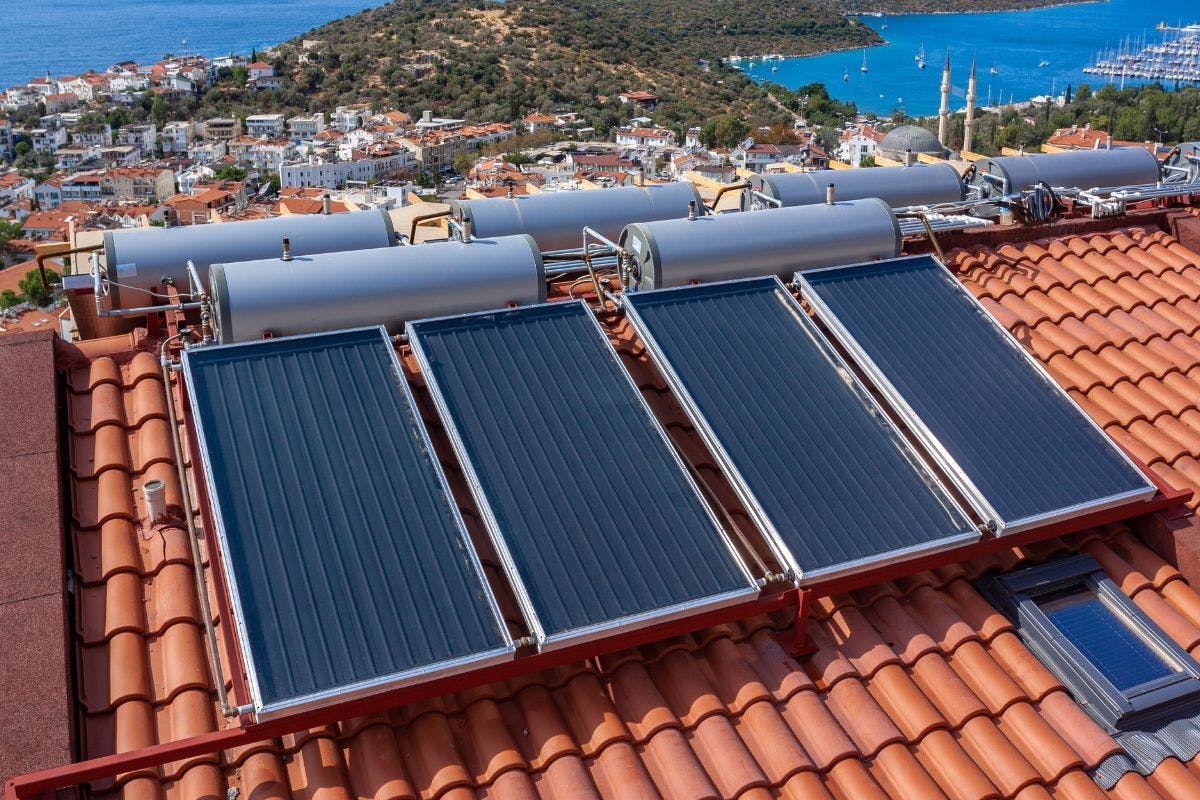 Solar water heaters on a tile roof.