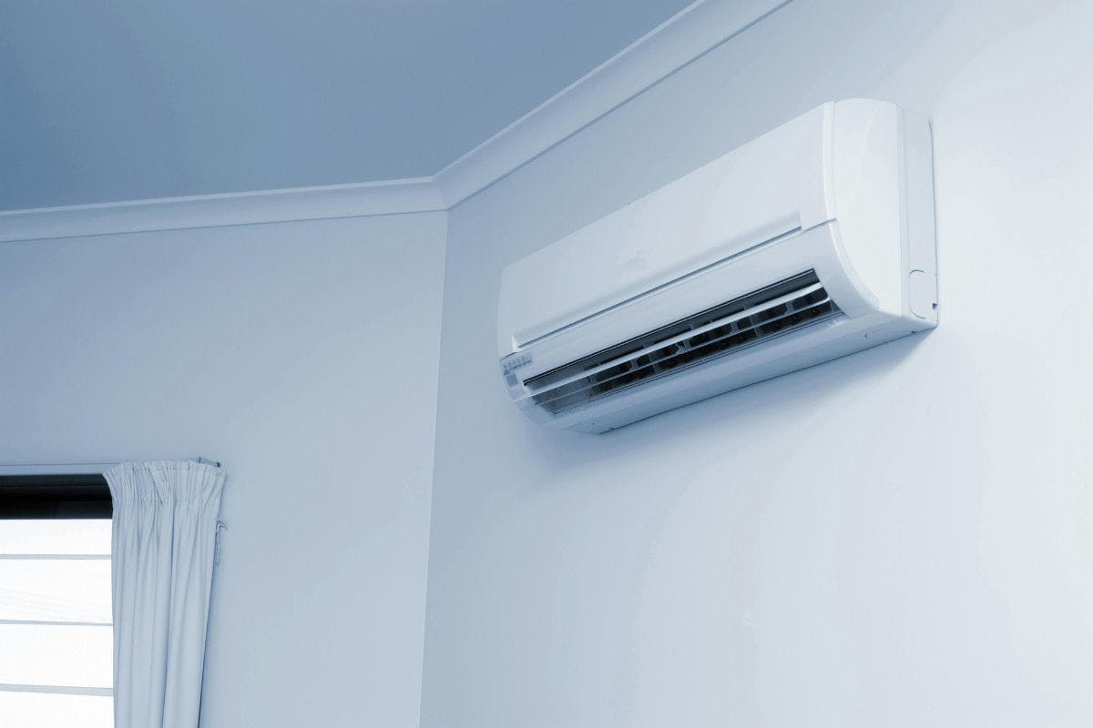 A mini-split air conditioner or heat pump on an interior wall.