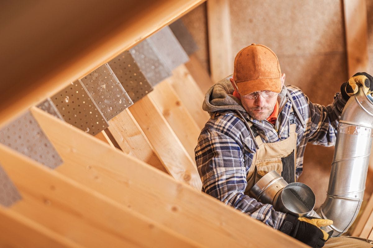 A worker in an attic.