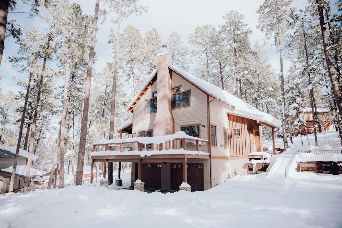 A house in a snowy woods.