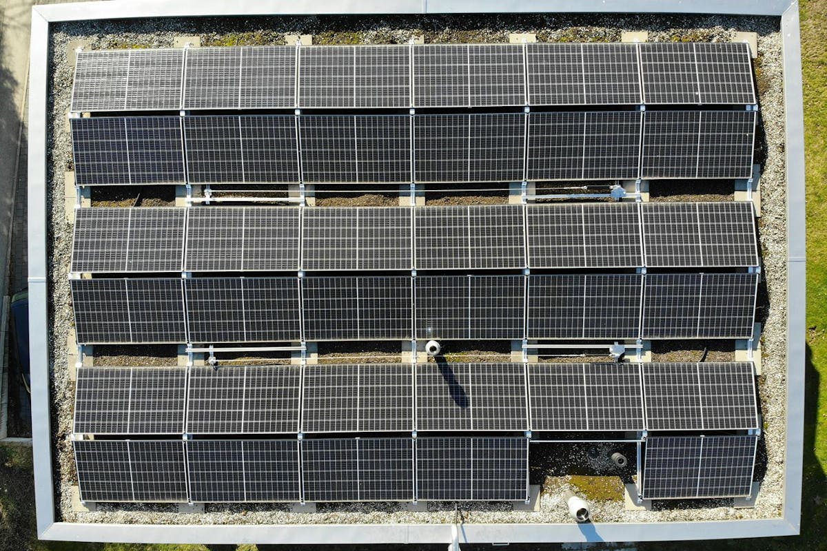 Solar panels installed on a large flat roof.
