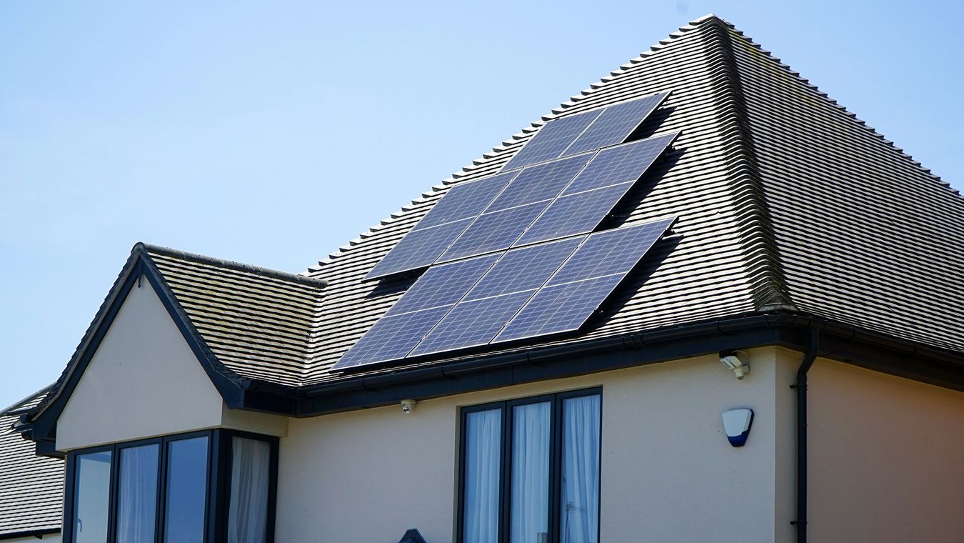 A house with solar panels on its roof.