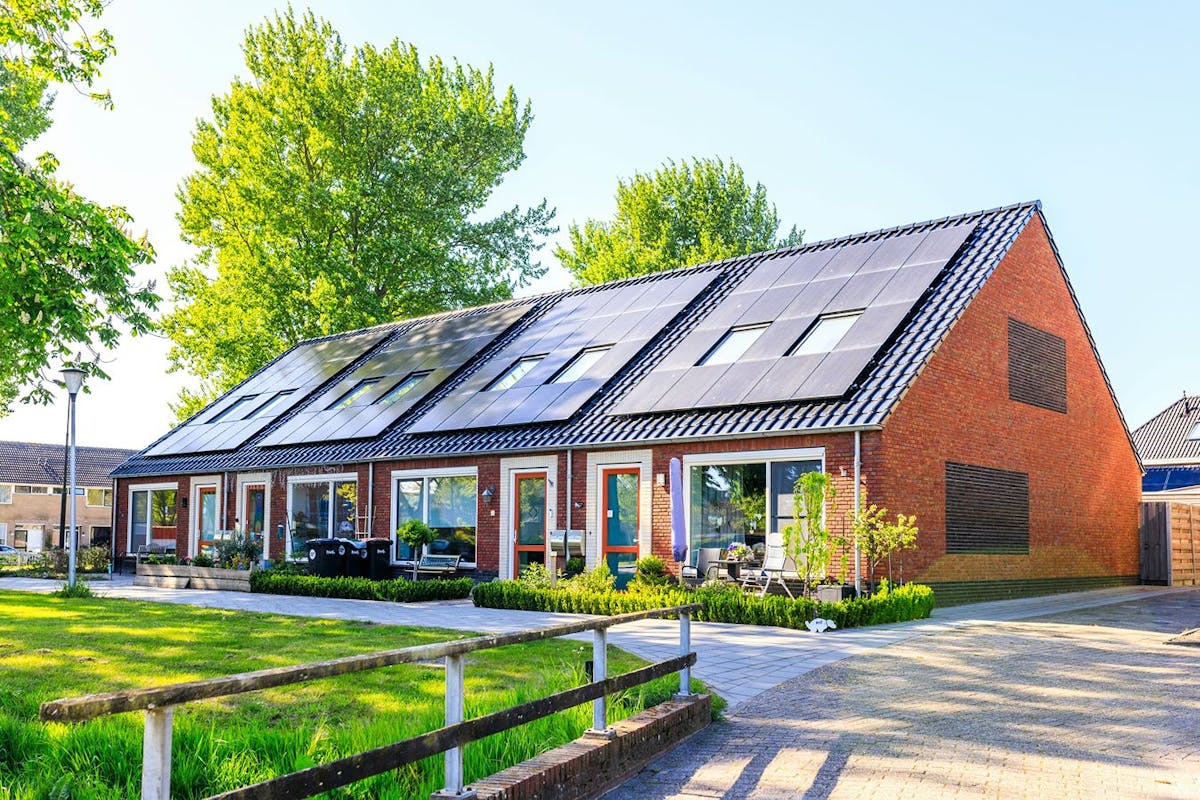 Solar panels on a brick house.