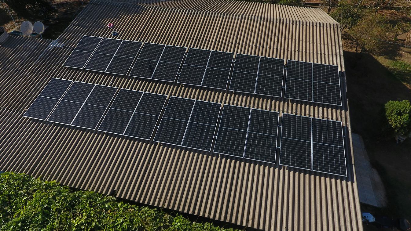Residential rooftop solar panels seen from above.