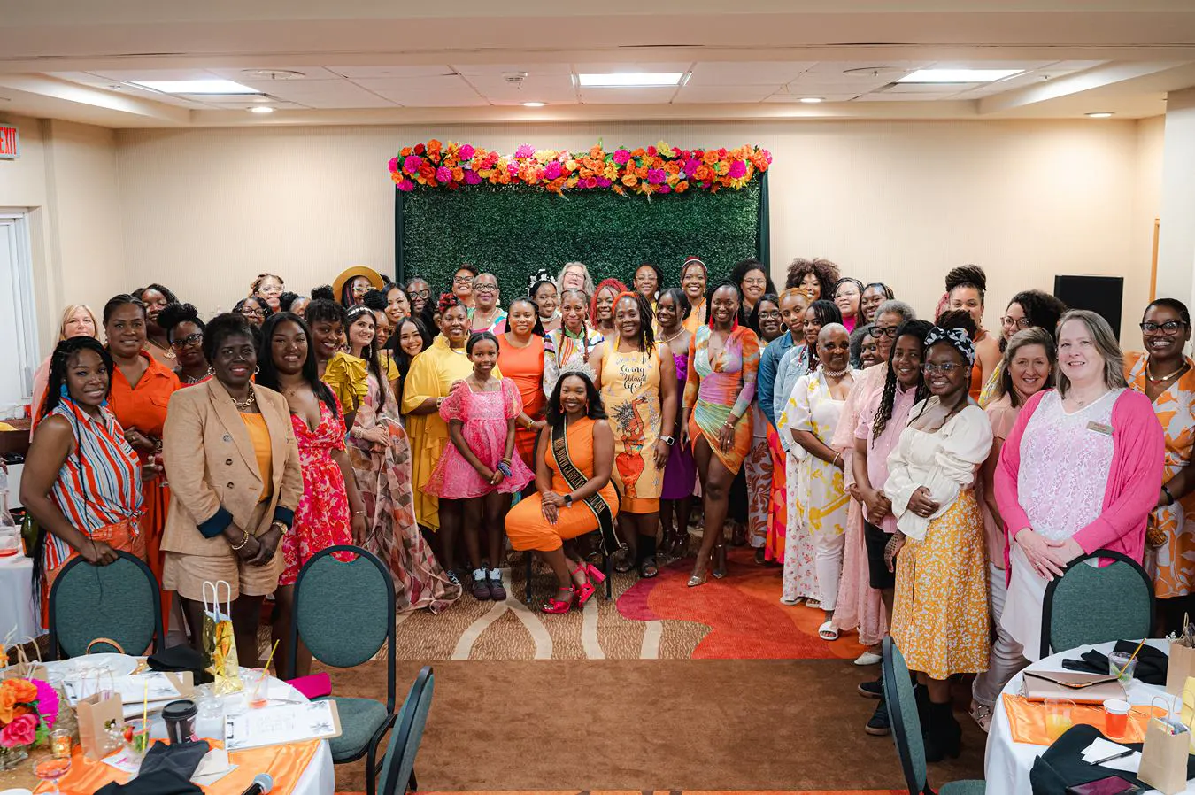 Lawrence at the center of a large group of people.