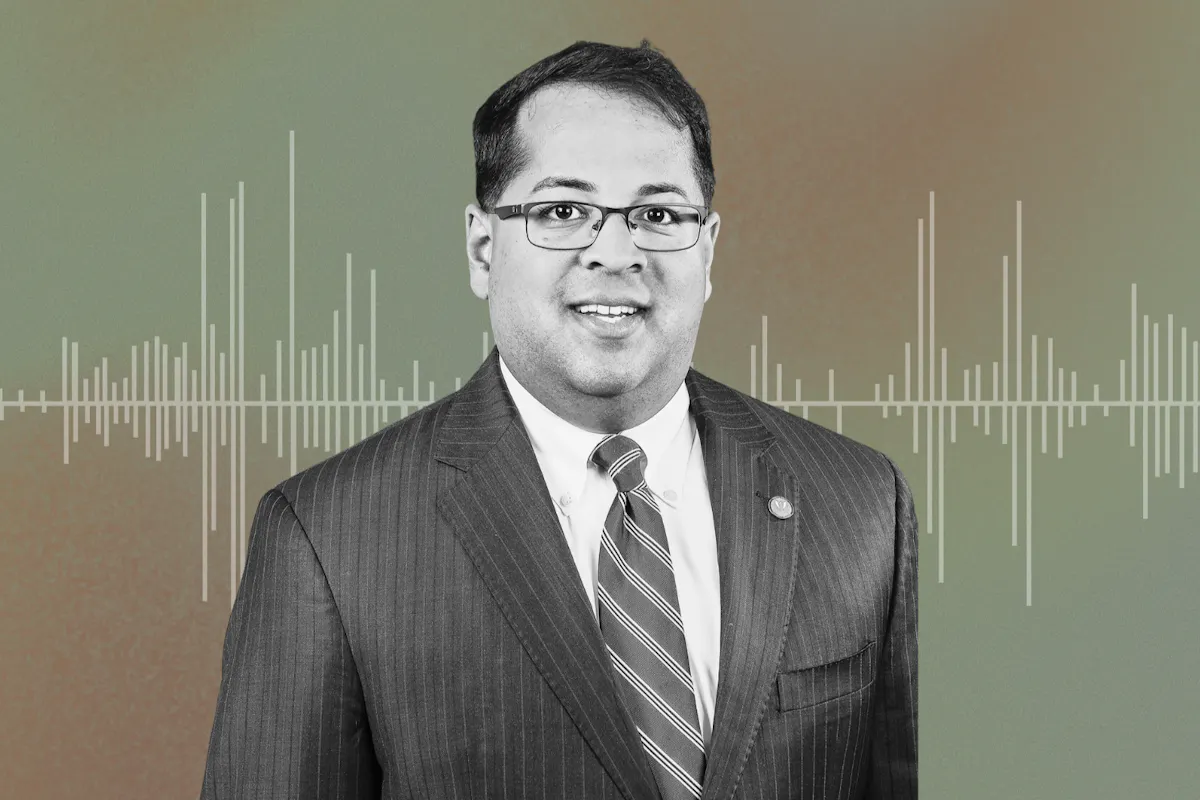 Neil Chatterjee's headshot and audio waves.