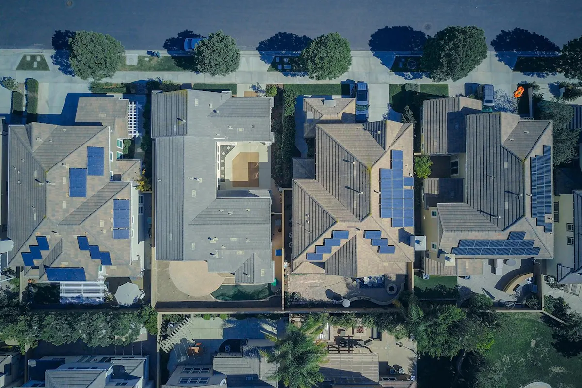 Rooftops with solar panels from the air.