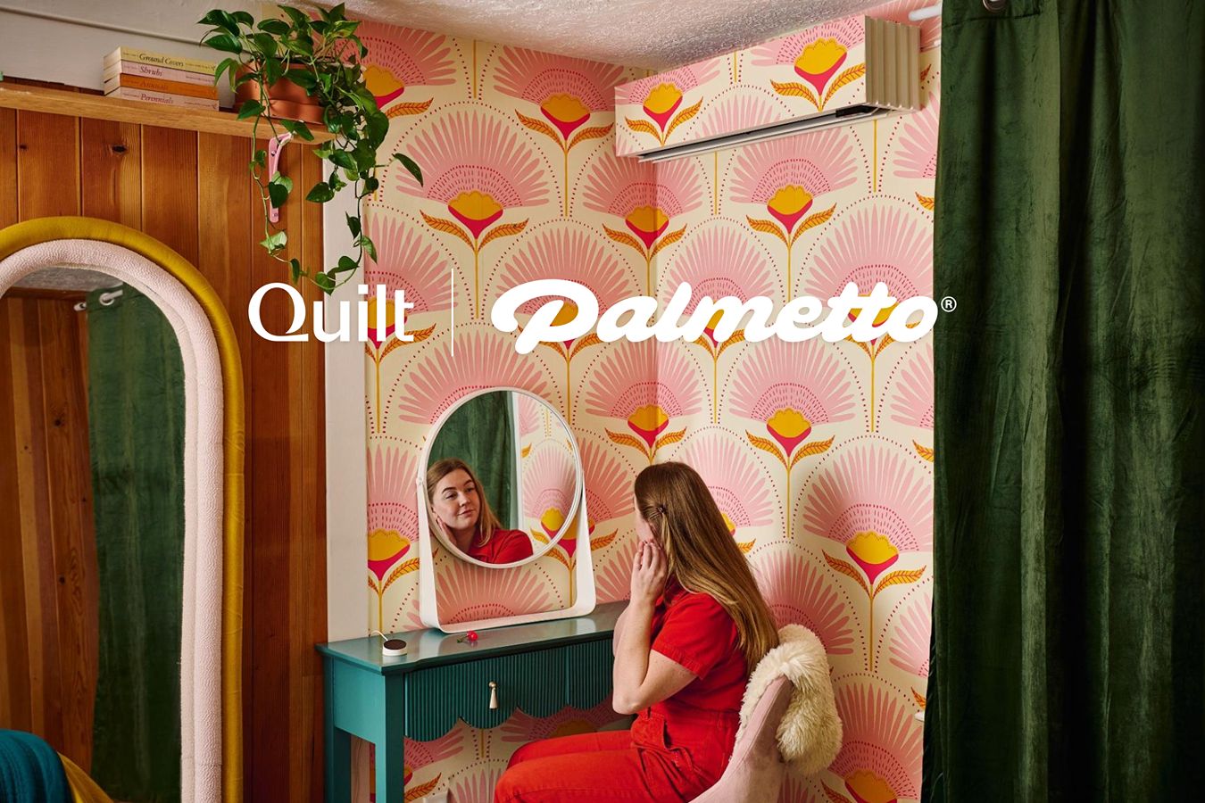 A woman looking in a mirror beneath a Quilt heat pump.