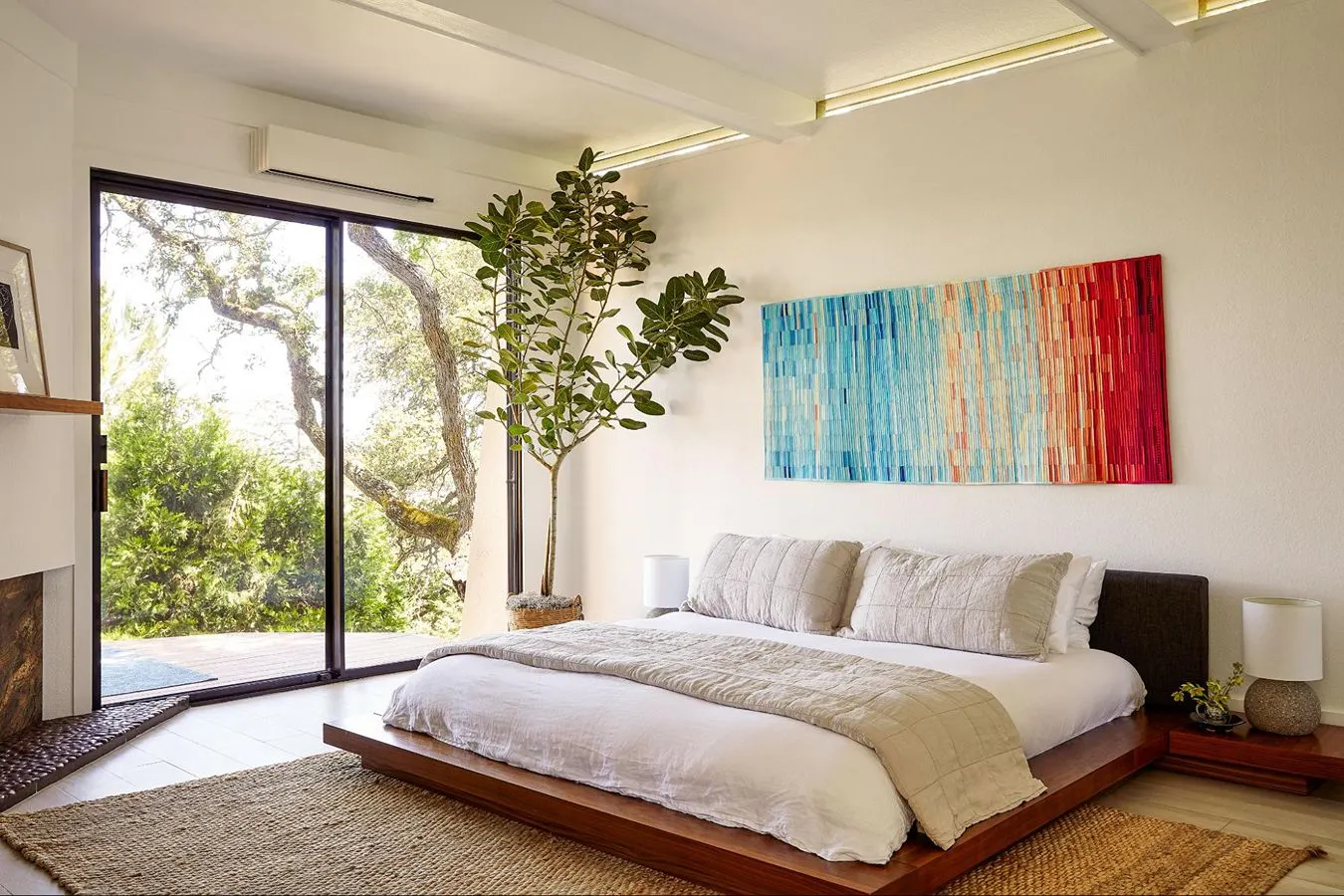 The interior unite of a Quilt heat pump in a well-lit bedroom.