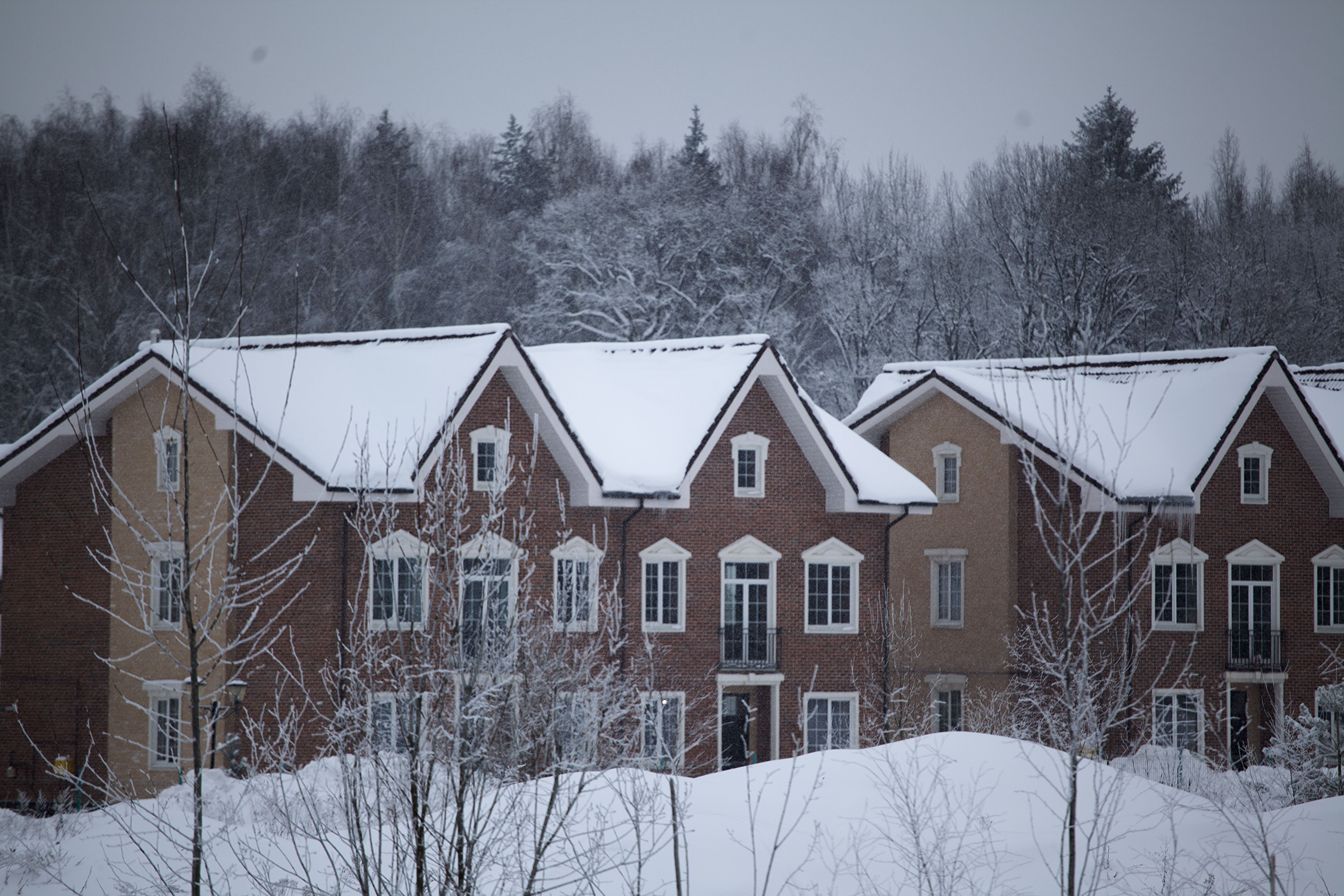 Houses covered in snow.