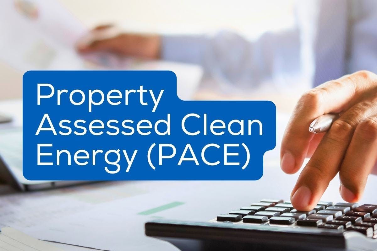 The words "Property Assessed Clean Energy (PACE)" over an image of a person calculating their PACE value, representing how PACE programs work, where they are available, and whether or not you can apply for one to help pay for your solar panels.
