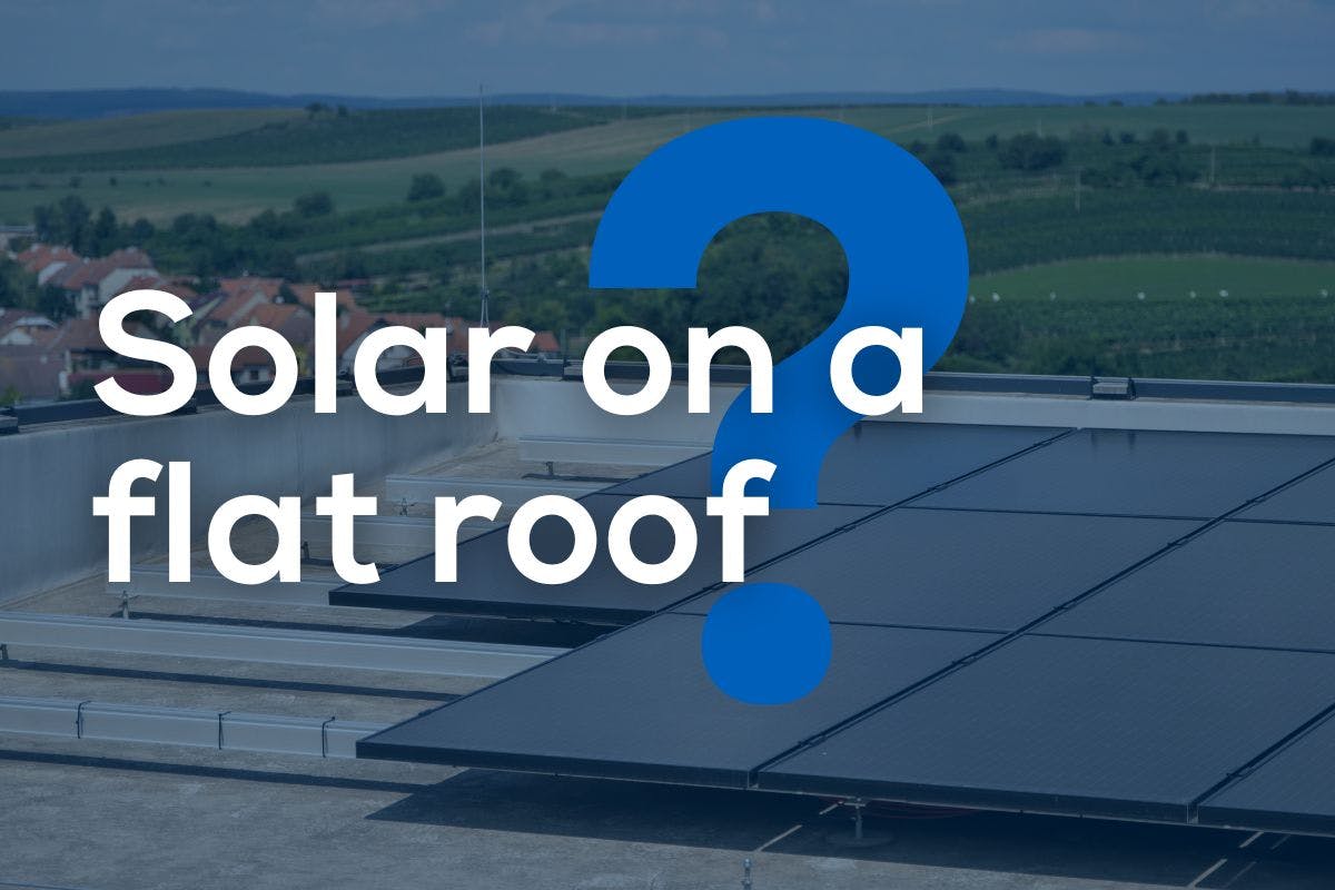 The words "Solar on a flat roof?" over an image of a flat roof home powered by solar panels.