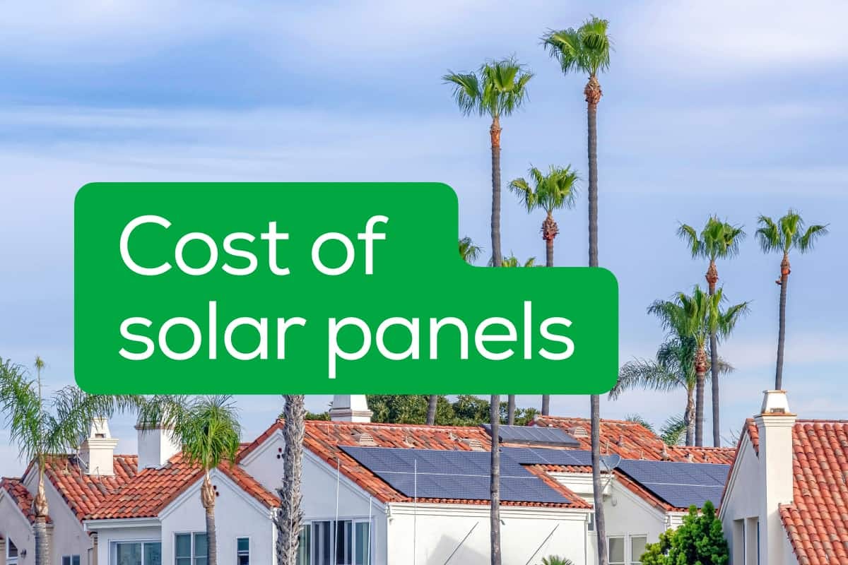The words "Cost Of Solar Panels" over an image of a neighborhood where many of the homes have installed solar power on their roof.