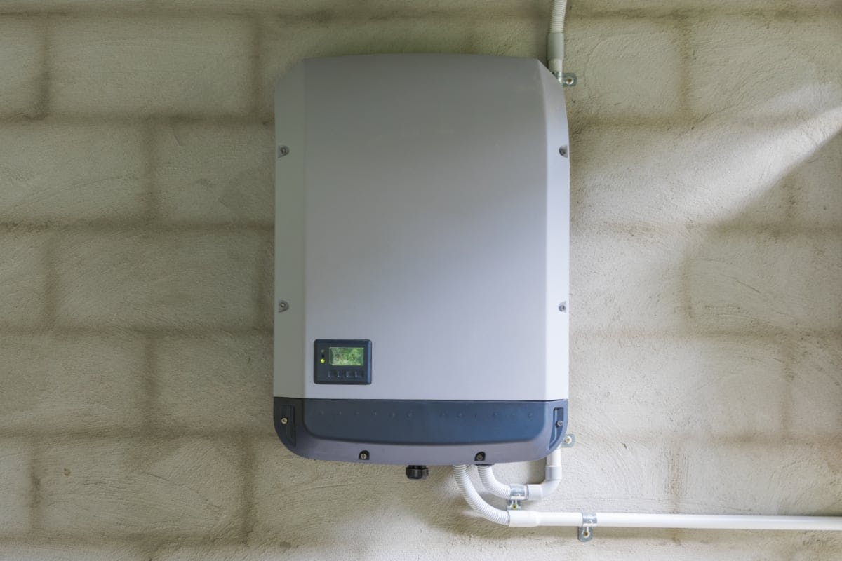 A solar inverter, which changes electricity from direct current (DC) into alternating current (AC) for use in the home.