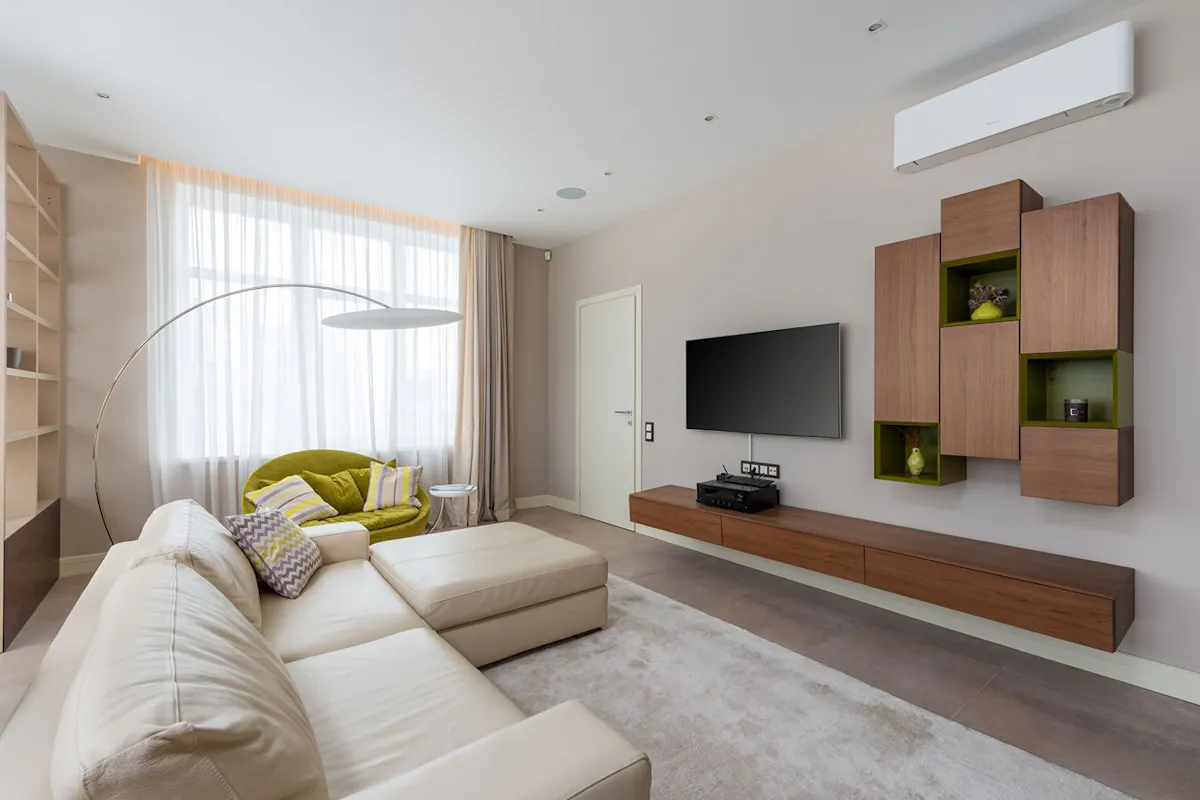 A modern interior with a mini-split heat pump installed high on the wall.