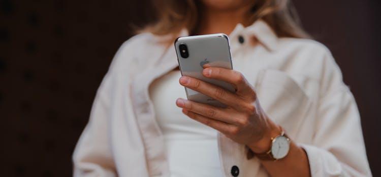 woman with cell phone in her hand