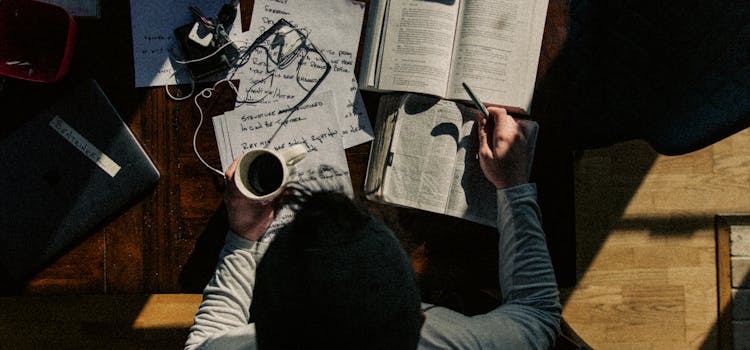 Student with notebooks on the table