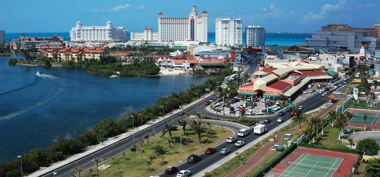 Cancun | Highways, sea, cars, very tall hotel buildings