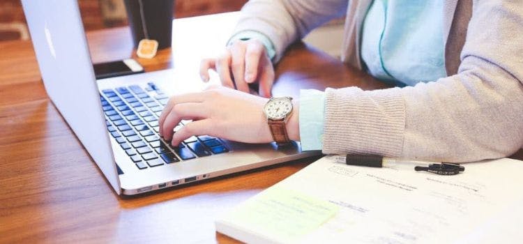 Person typing on a laptop