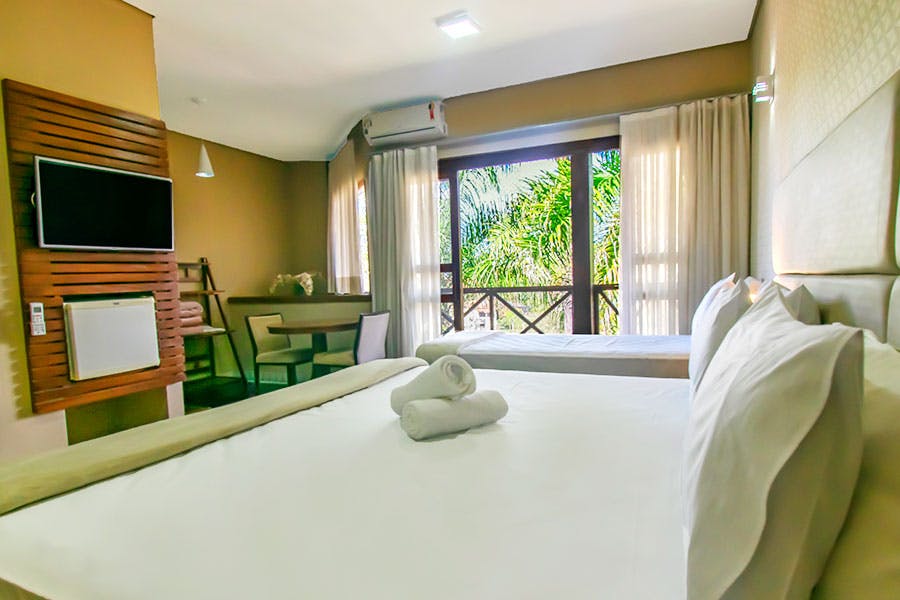 quarto de hotel fazenda espaçoso e aconchegante
