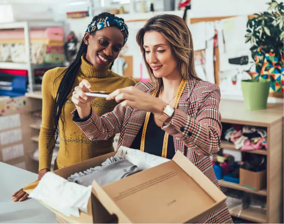 Women discussing the business side of fashion and luxury