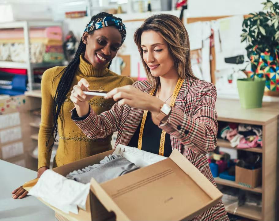 Women discussing the business side of fashion and luxury