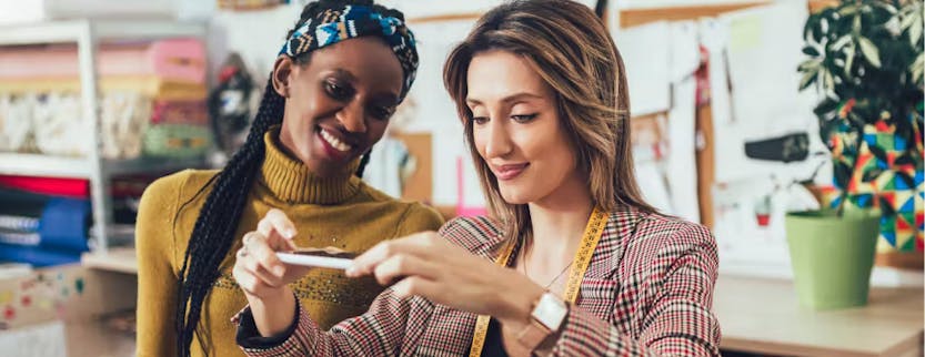 Women discussing the business side of fashion and luxury