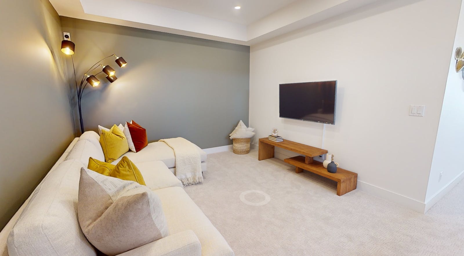 Cozy living space with a TV and lamp.