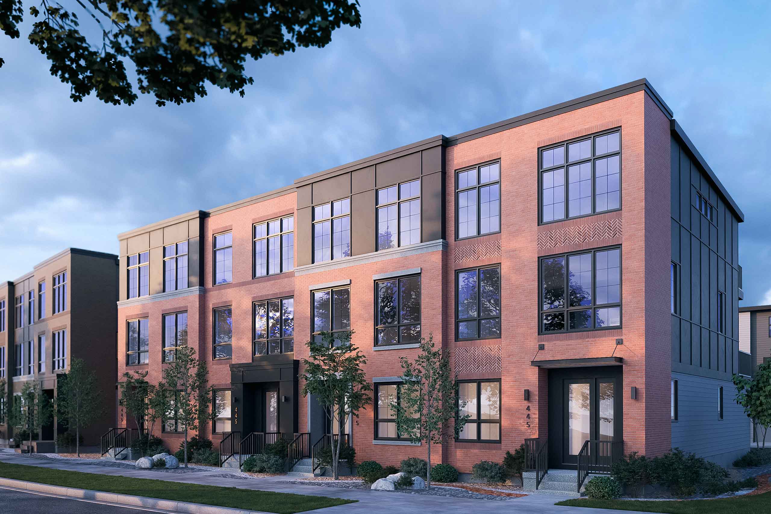 An exterior rendering of the Upper Greenwich Classic Townhomes with a red brick facade