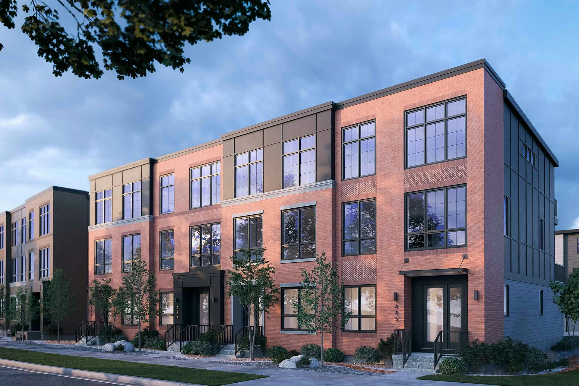 An exterior rendering of the Upper Greenwich Classic Townhomes with a red brick facade