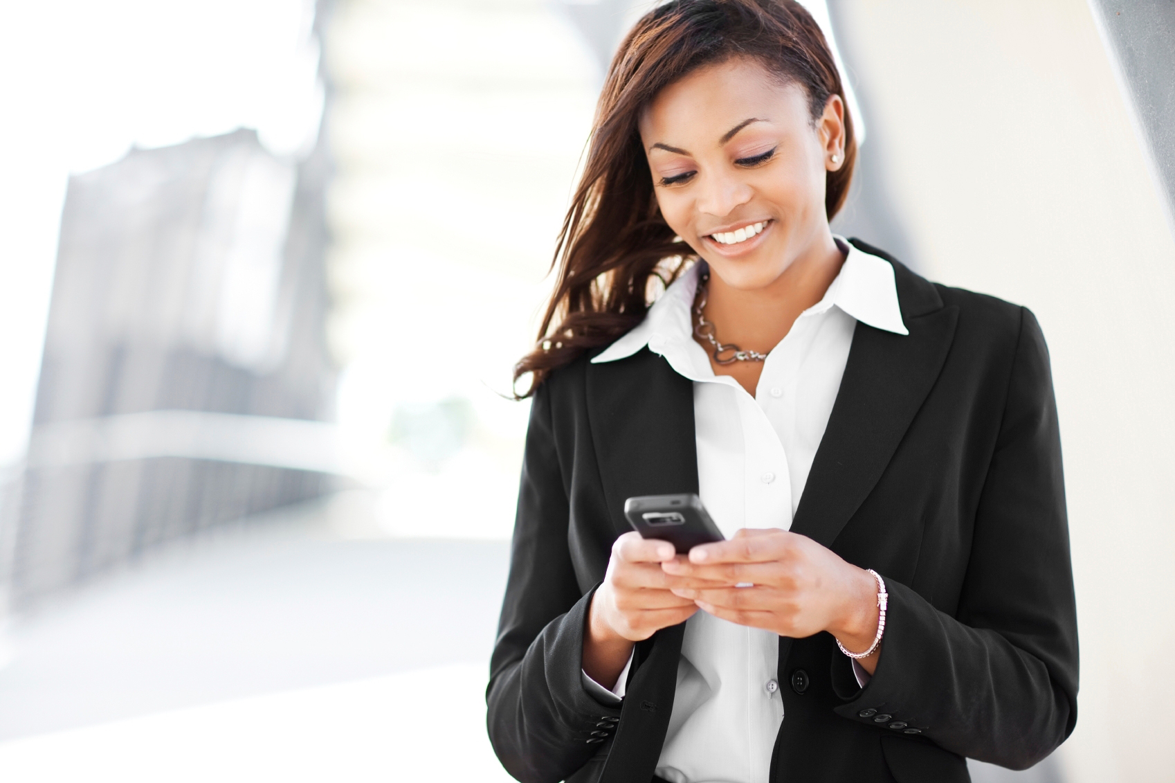 https://images.prismic.io/passio/aEuiNrNJEFaPX7rX_businesswomantexting.jpg?ixlib=gatsbyFP&auto=format%2Ccompress&fit=max