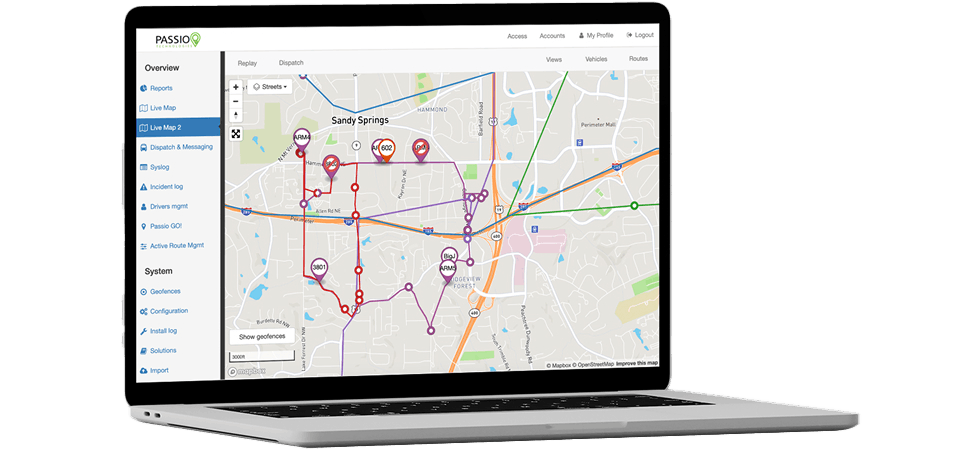 Open laptop displaying the Passio Navigator™ Live View interface, featuring a detailed city map with real-time vehicle routes, stop icons, and tracking tools