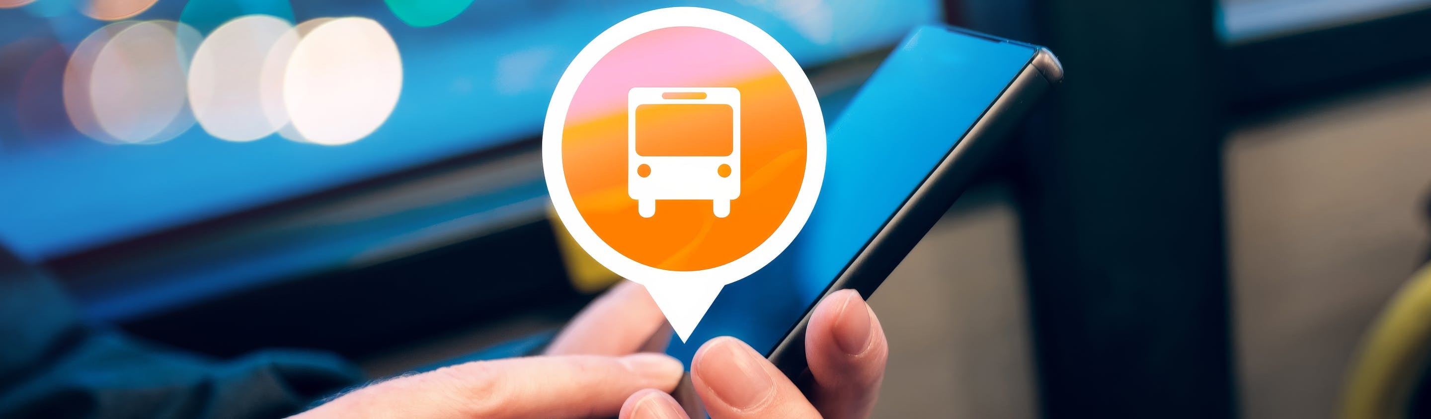 Close-up of a person using a smartphone on public transit, with an overlaid icon of a bus inside a location pin, representing Passio OpsView™ for real-time transit system monitoring and operational alerts.