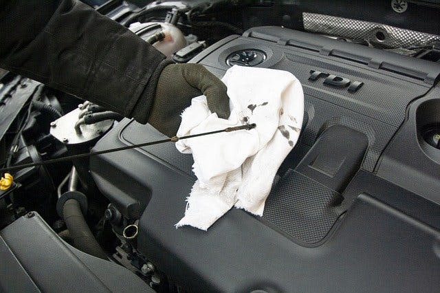Open the bonnet and tell me how you’d check that the engine has sufficient oil.