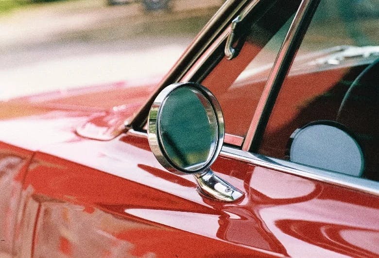 An image of a car mirror on a ed vintage car 