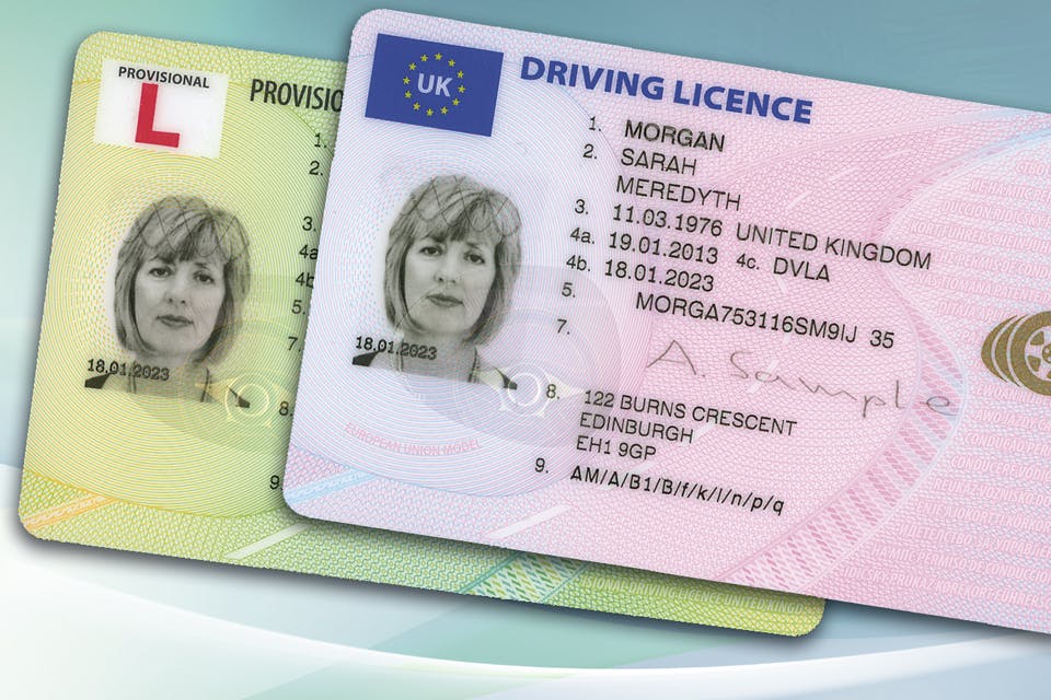 A green provisional UK driving licence next to a full pink UK driving licence