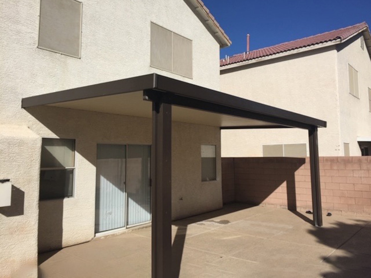 Las Vegas residence with dark brown solid aluminum patio cover on back patio