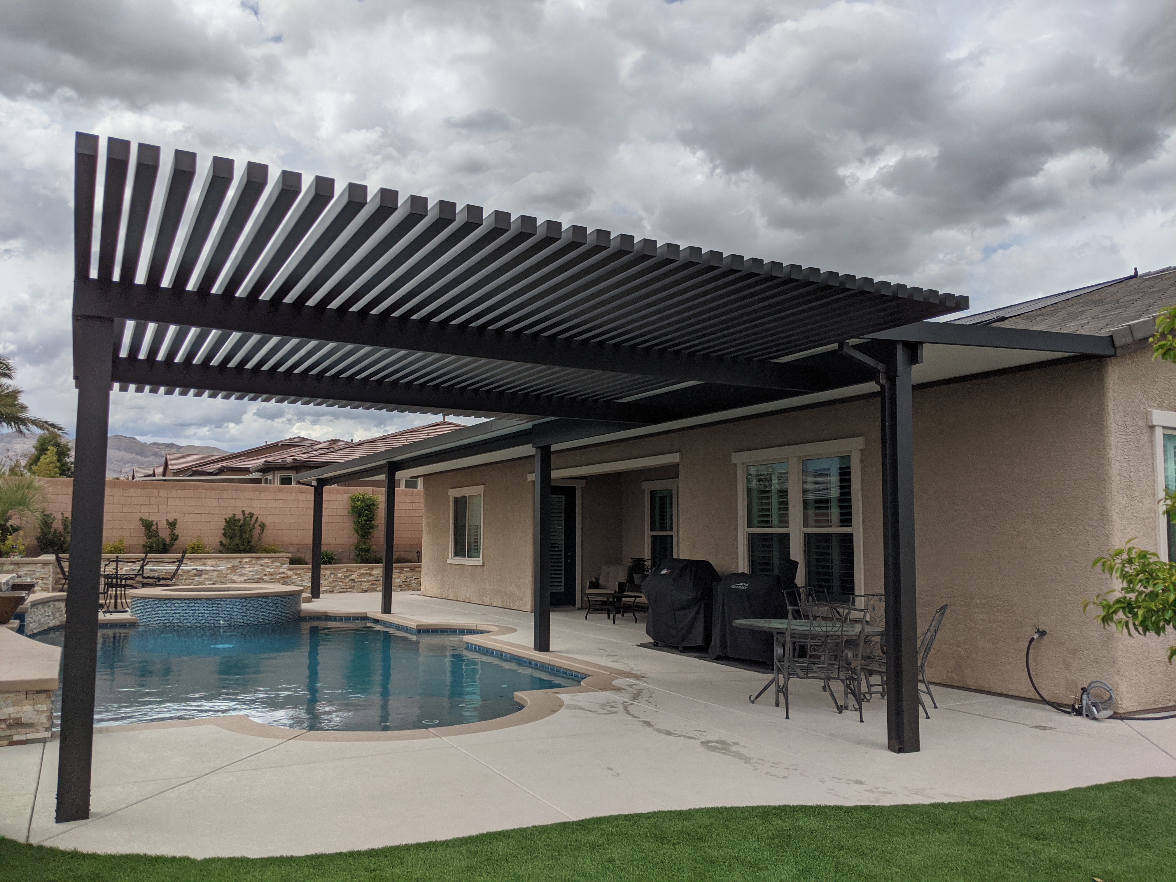 Combination lattice and solid 4K aluminum patio cover by poolside in Las Vegas, Nevada