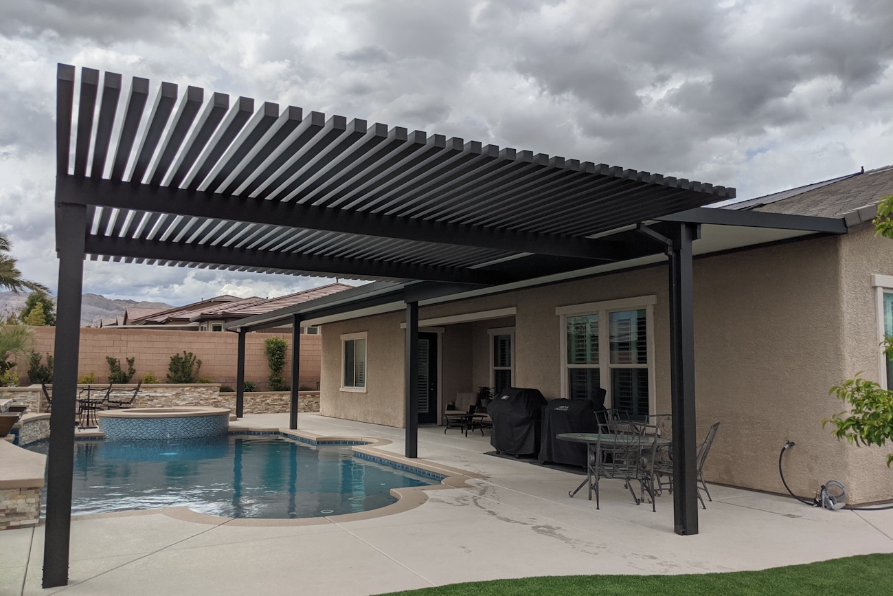 Combination lattice and solid 4K aluminum patio cover by poolside in Las Vegas, Nevada
